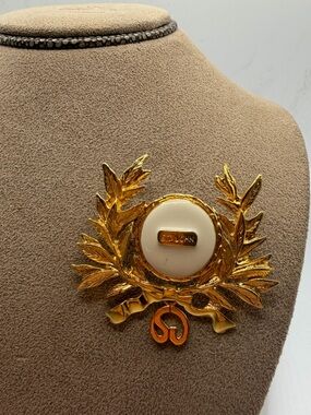 St. John Gold-Tone Laurel Brooch with Cream Center and Signature Plaque